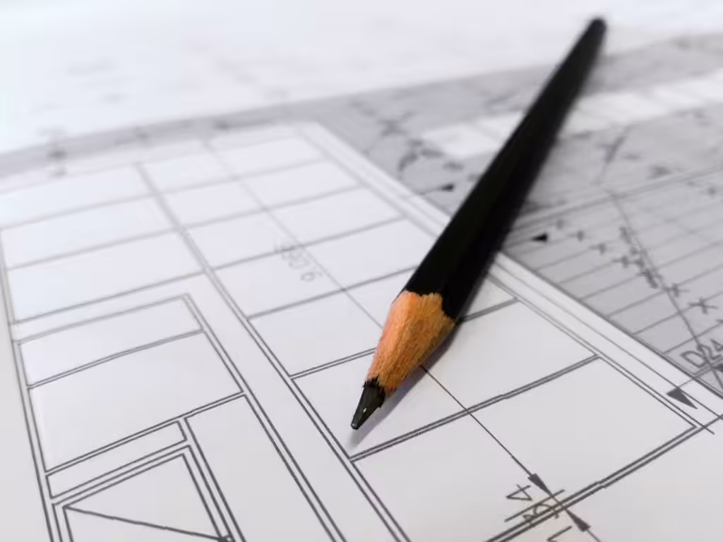 Recent Projects | Fitted Bedroom in Redditch by Tefore-A Calming Retreat Detailed image of a black pencil resting on architectural blueprints, ideal for design and planning themes.