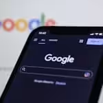 Recent Projects | Elegant Kitchen – Designed, Supplied & Installed in Redditch Smartphone screen showing Google search in dark mode with the Google logo in the background.
